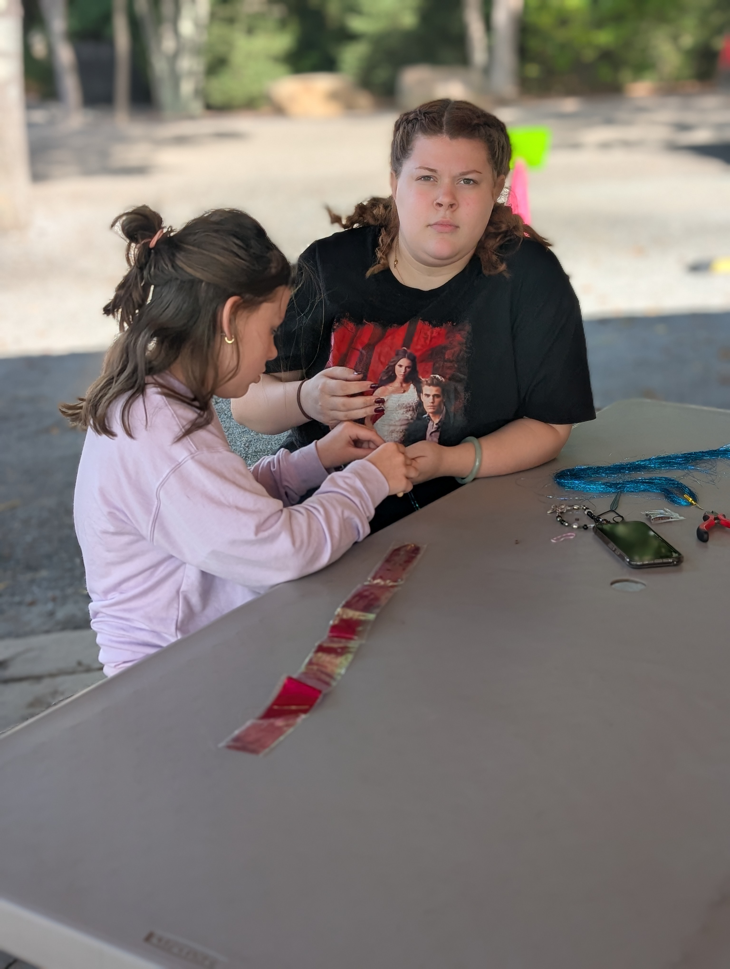 Young attendees enjoying an activity together at Family Fall Fest