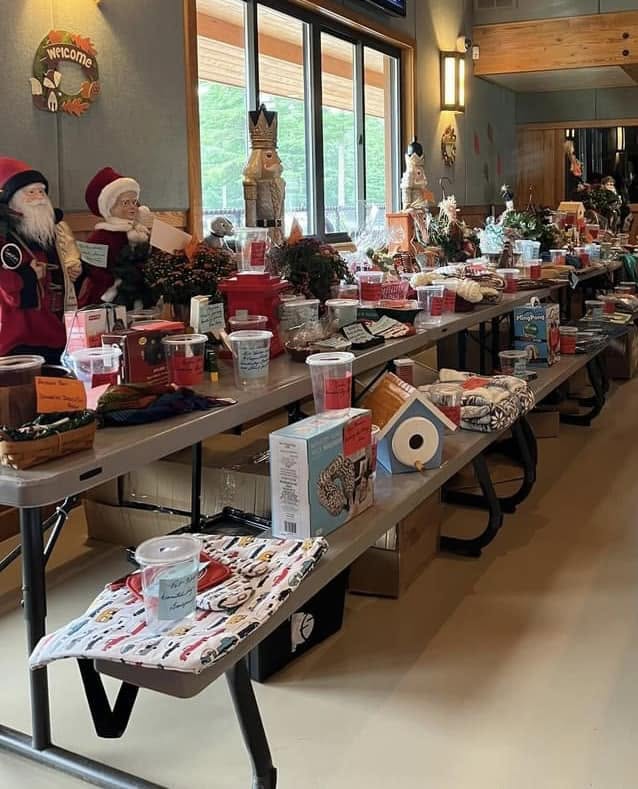 Tables of donated raffle prizes at a Halo’s Wish fundraising event