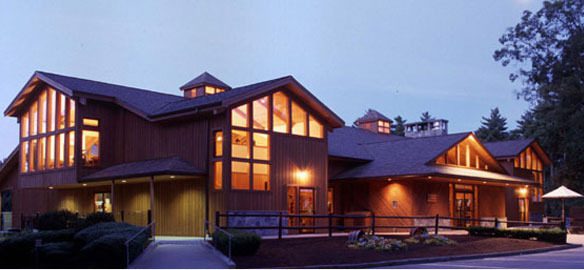 Normandy Farms Recreation Lodge illuminated in the evening